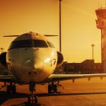 plane at airport in sunset